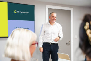 Chris Timmins, MD at SH Partnerships, presenting, team meeting, collaboration